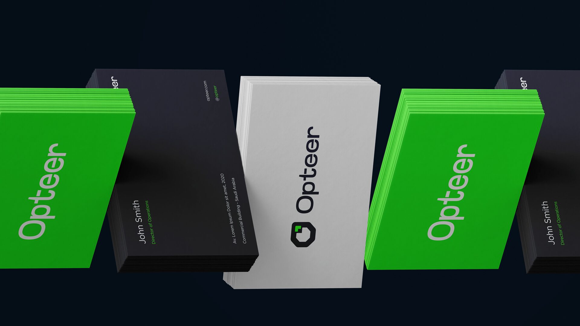 FIG.03 — stacks of Opteer business cards standing on a dark ground, alternating green, black and white edges